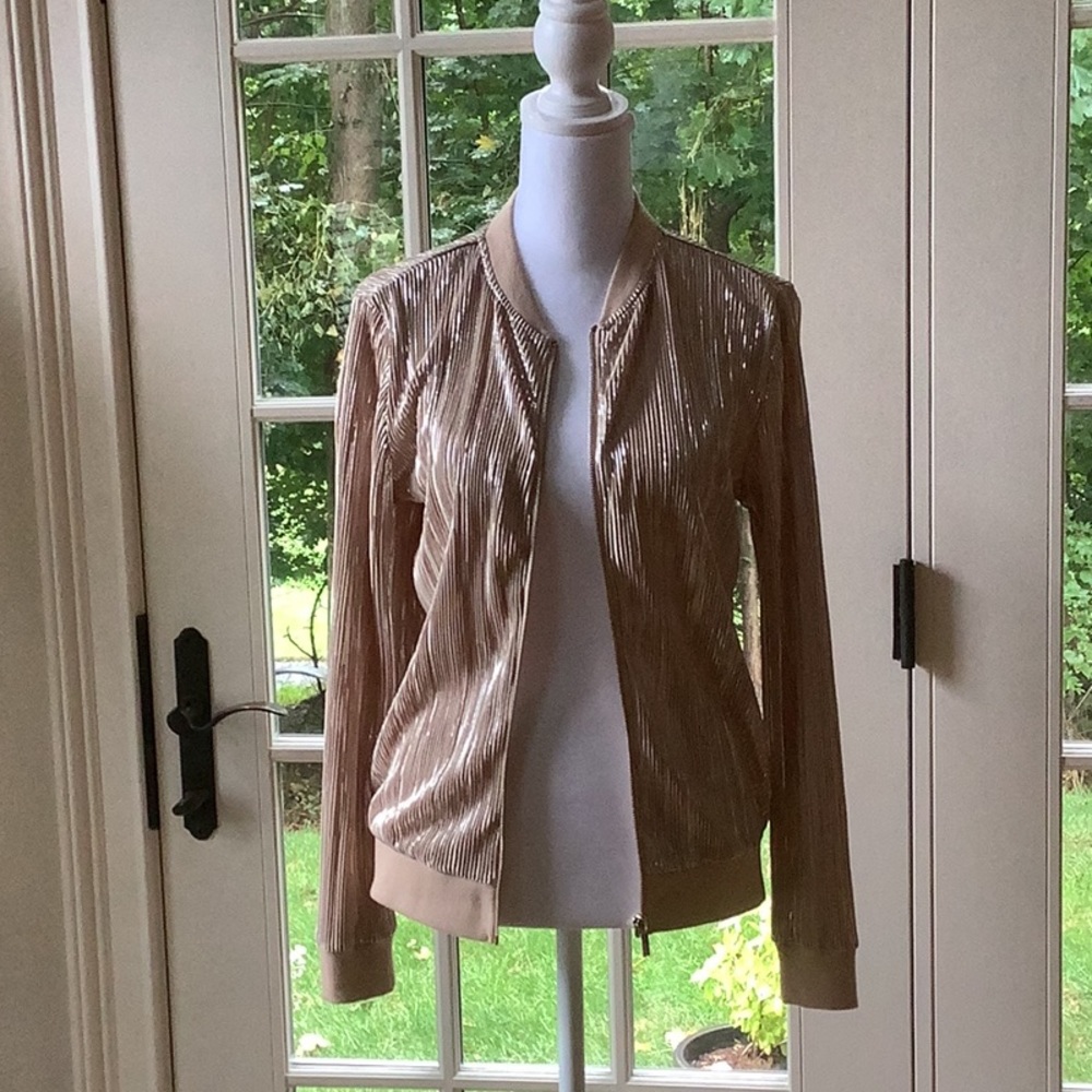 Iman light weight gold zip up jacket. Size XS  Good condition. Never worn.